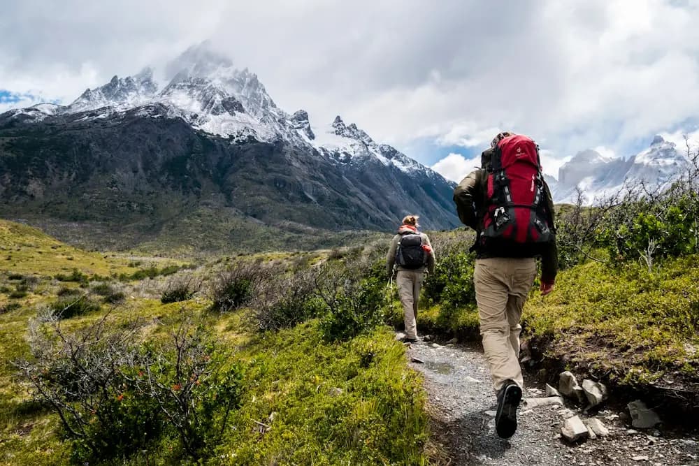 Guide leading trekkers along a mountain ridge